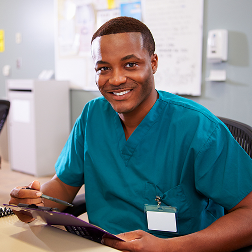 Medical Assistant verifying patient’s information by recording medical history and confirming purpose of visit.